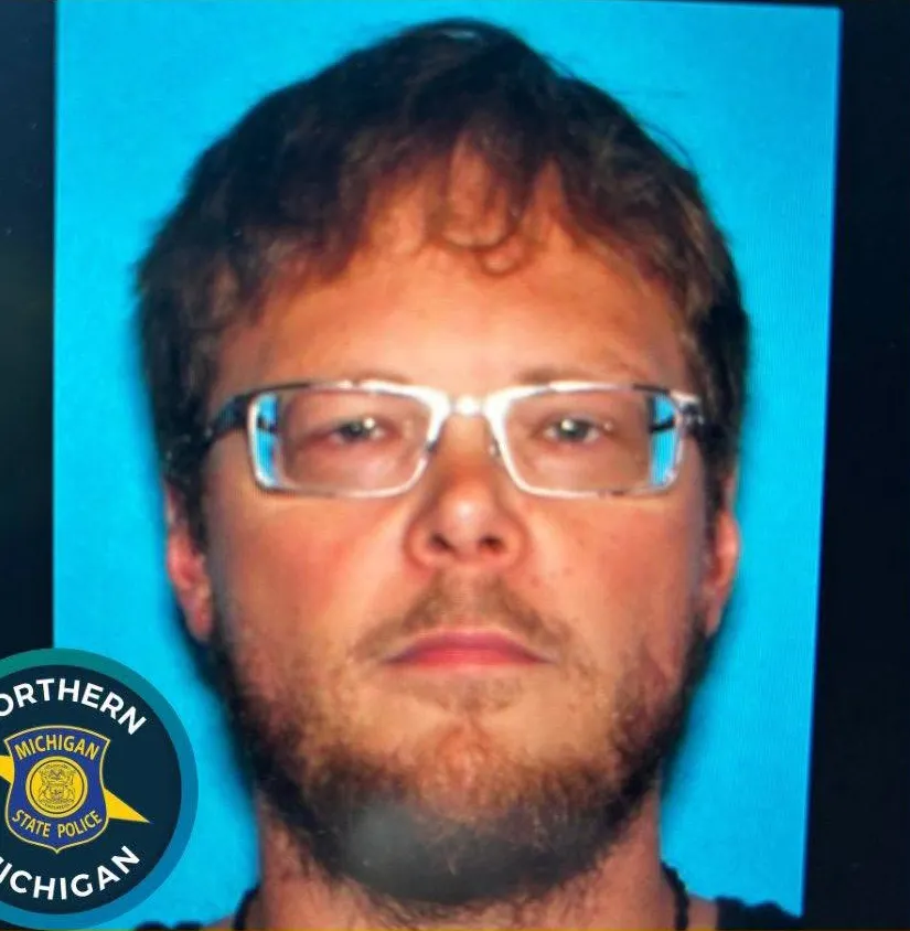 Mugshot of Chad Hickman, a person of interest in a Missaukee County shooting.