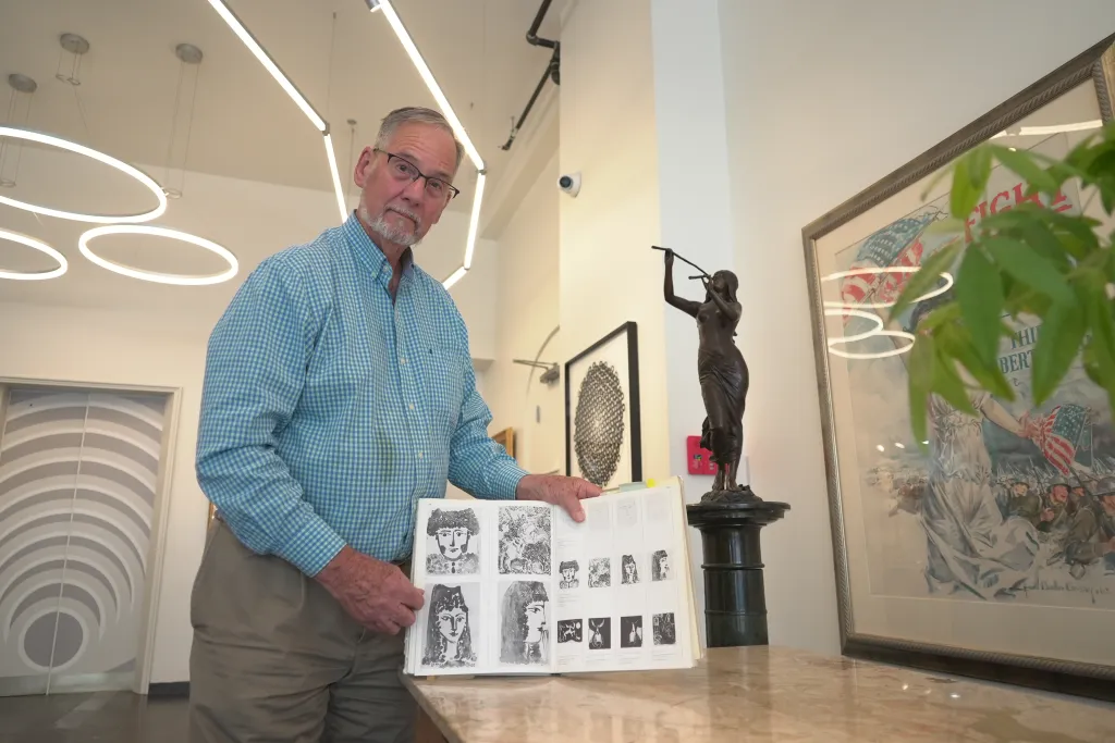 Art dealer Bill DeLind shows off a picture of Picasso's sketch stolen from DeLind Fine Art Appraisals in 2018.