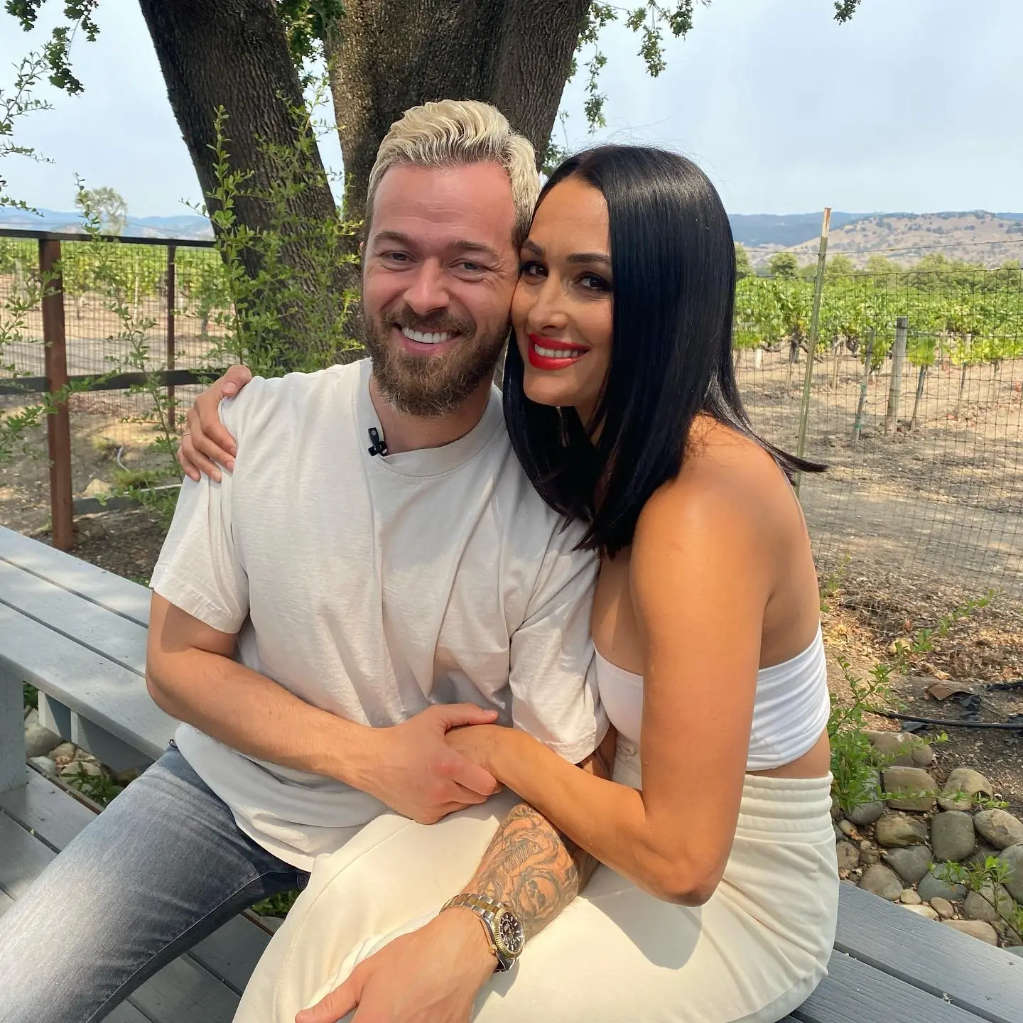 Artem Chigvintsev and Nikki Bella pose together.