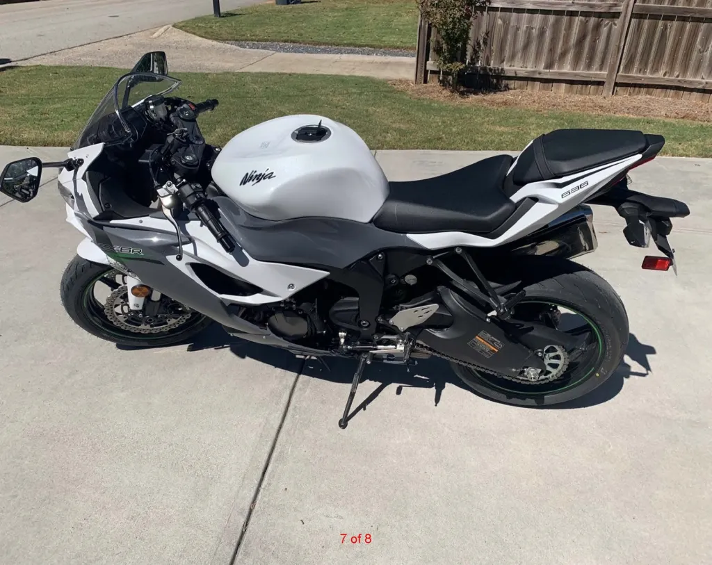 A white and gray Kawasaki Ninja motorcycle.