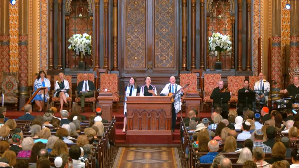 A Friday night service at Central Synagogue with a choir and musicians performing to a seated congregation.