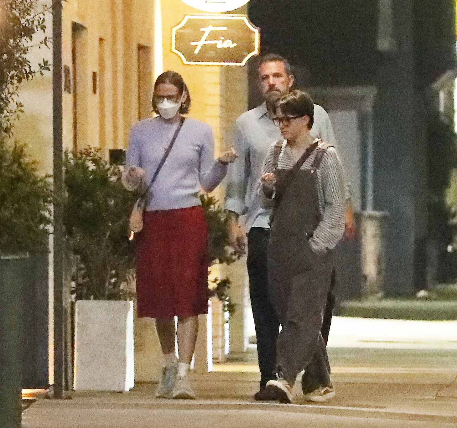 Ben Affleck with his children, including his daughter Violet in a mask, outside Fia restaurant.