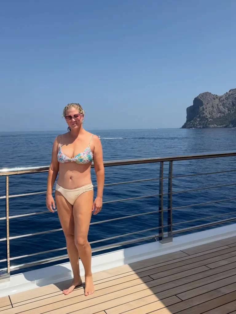 Amy Schumer in a bikini on a boat.