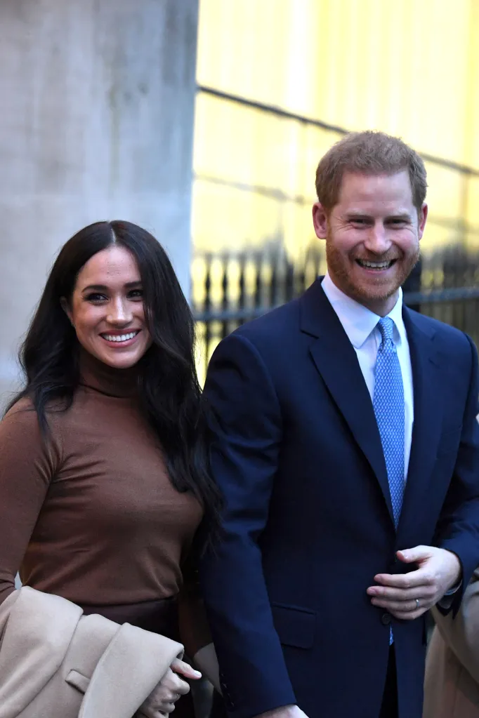 Prince Harry, Duke of Sussex, and Meghan, Duchess of Sussex, smile while leaving Canada House.