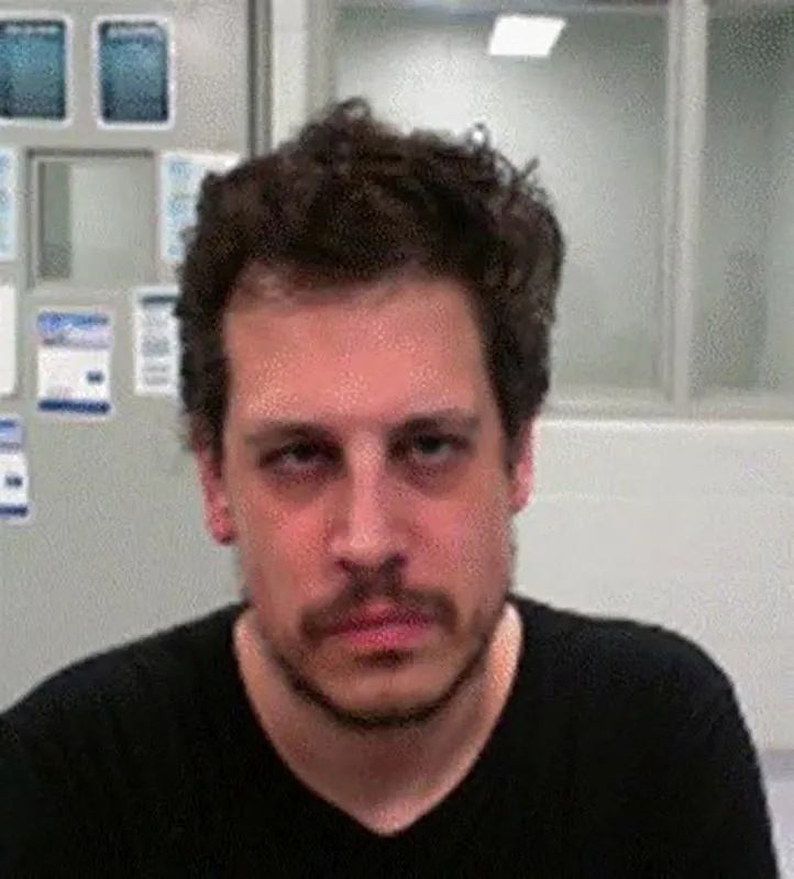 Milo Yiannopoulos poses after his arrest by federal immigration agents at the Louis Armstrong New Orleans International Airport.
