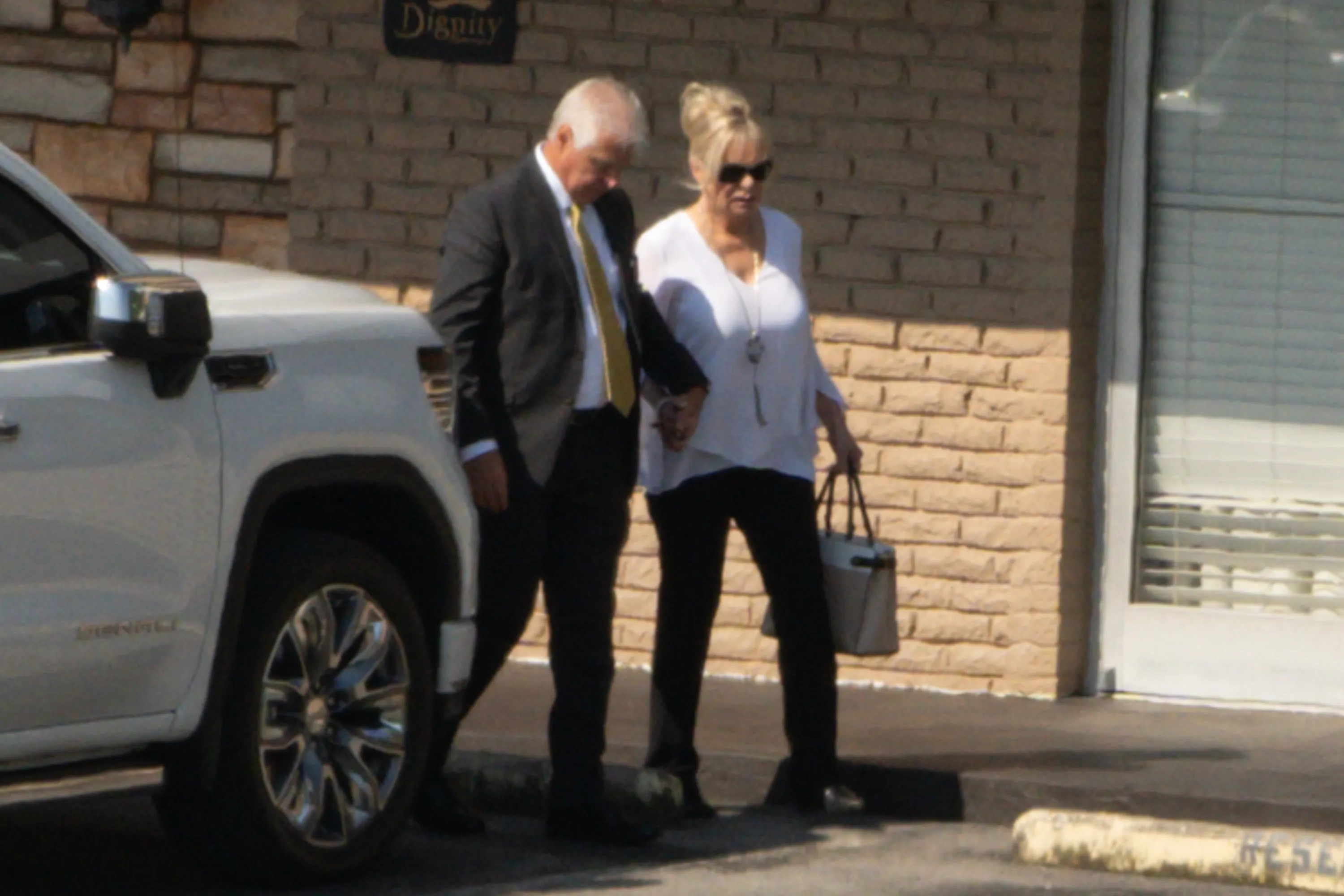 Bryan Seaver with what appears to be Dolly Parton's family at a funeral home.