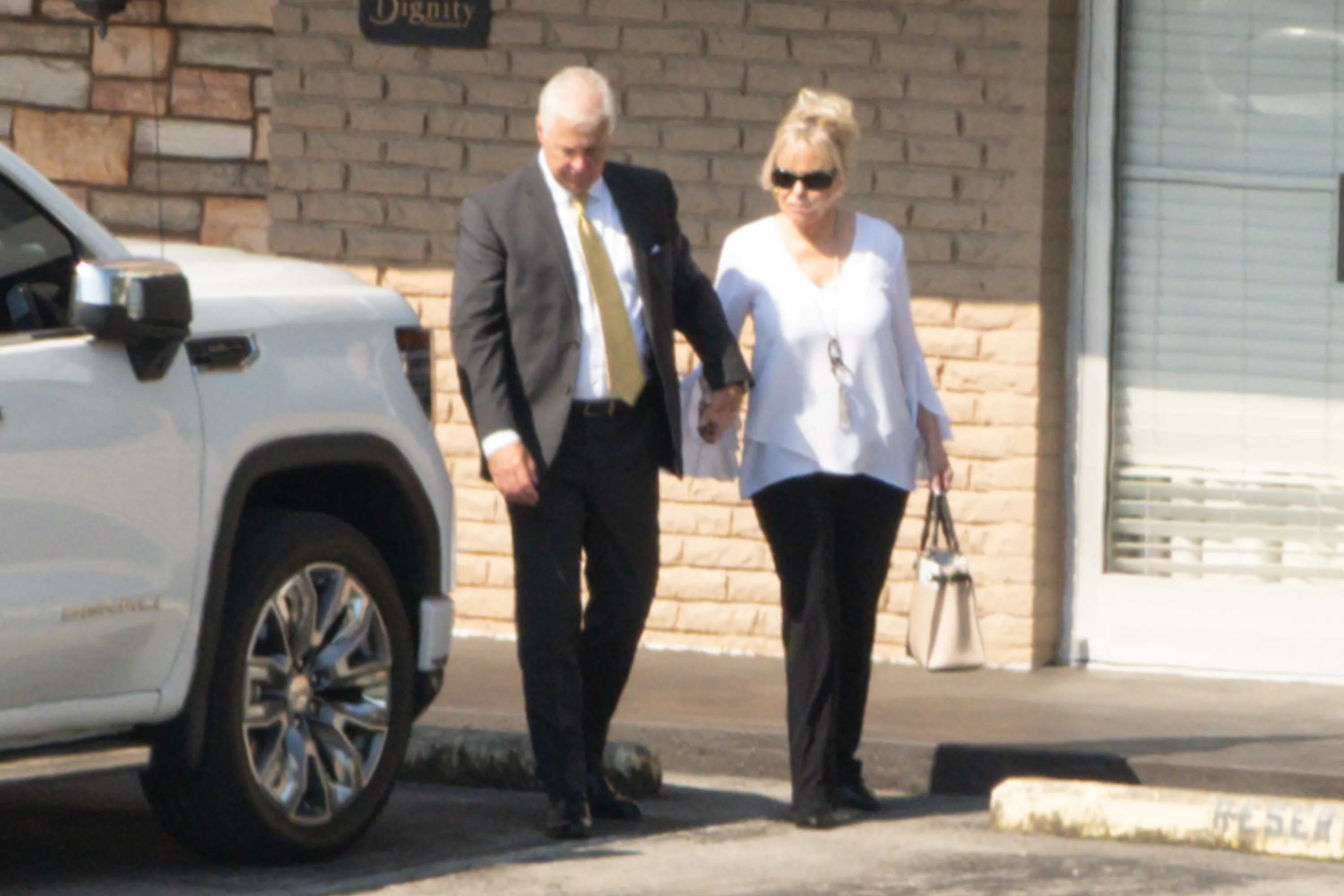 Bryan Seaver and a woman believed to be a relative of Dolly Parton seen outside Woodlawn Funeral Home.