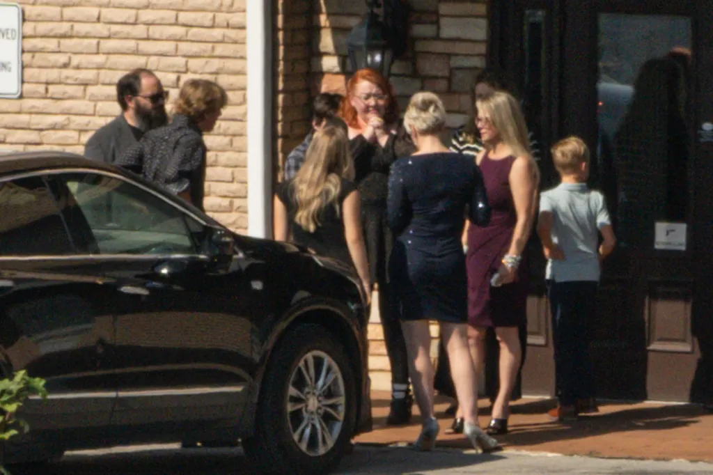 Bryan Seaver is seen with what appears to be Dolly Parton’s family at the Woodlawn Funeral home.