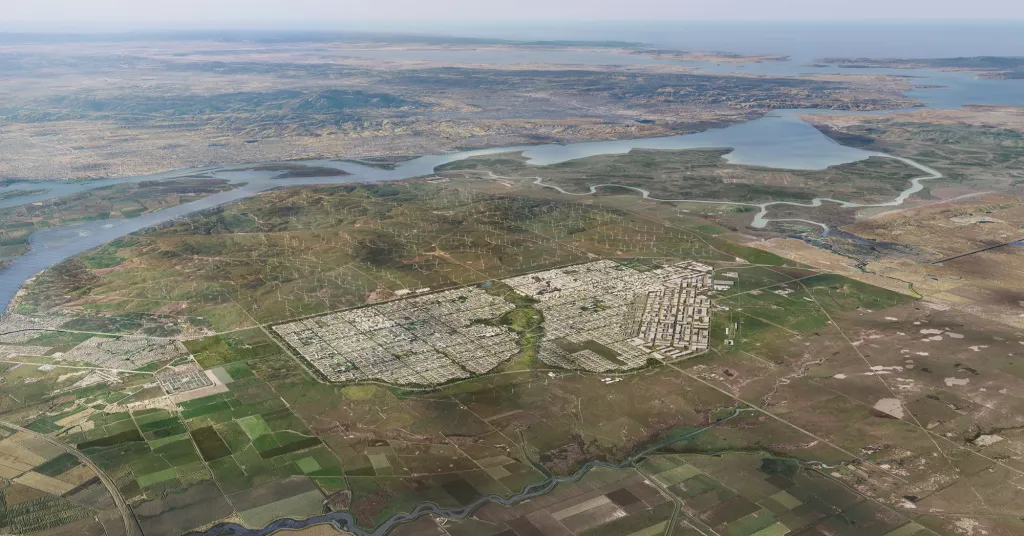 Illustration of an aerial view of a planned city (California Forever - The Foundry) with a river, fields, and wind turbines in the background.