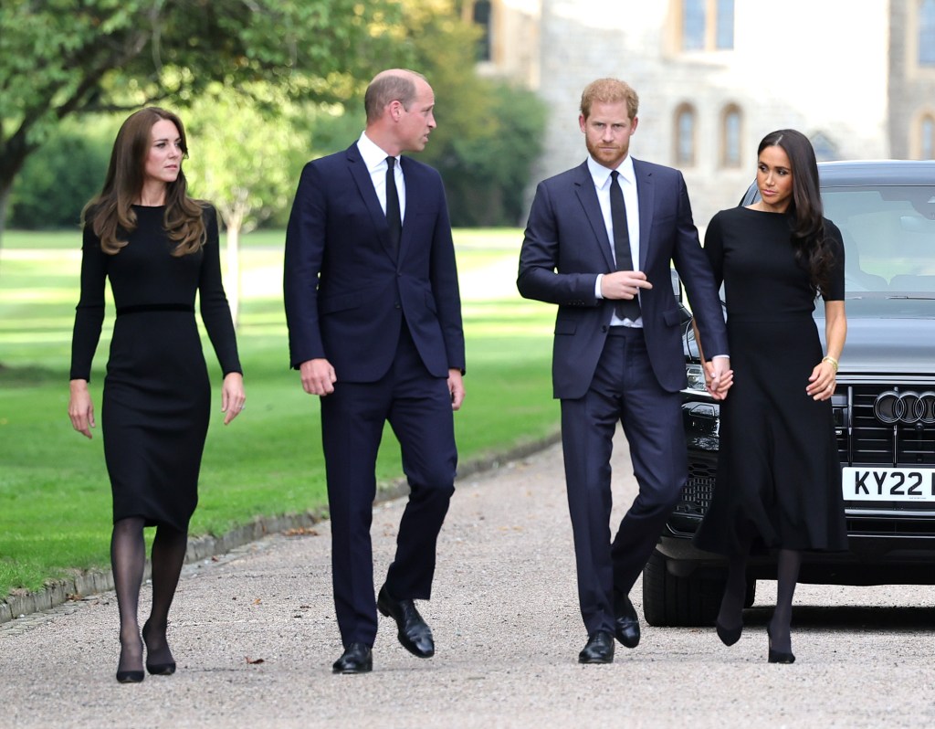 The Prince and Princess of Wales, and the Duke and Duchess of Sussex, walk together outside Windsor Castle to greet well-wishers.