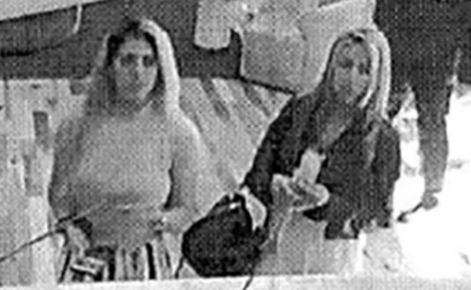 CCTV grab of two women in a hotel room.