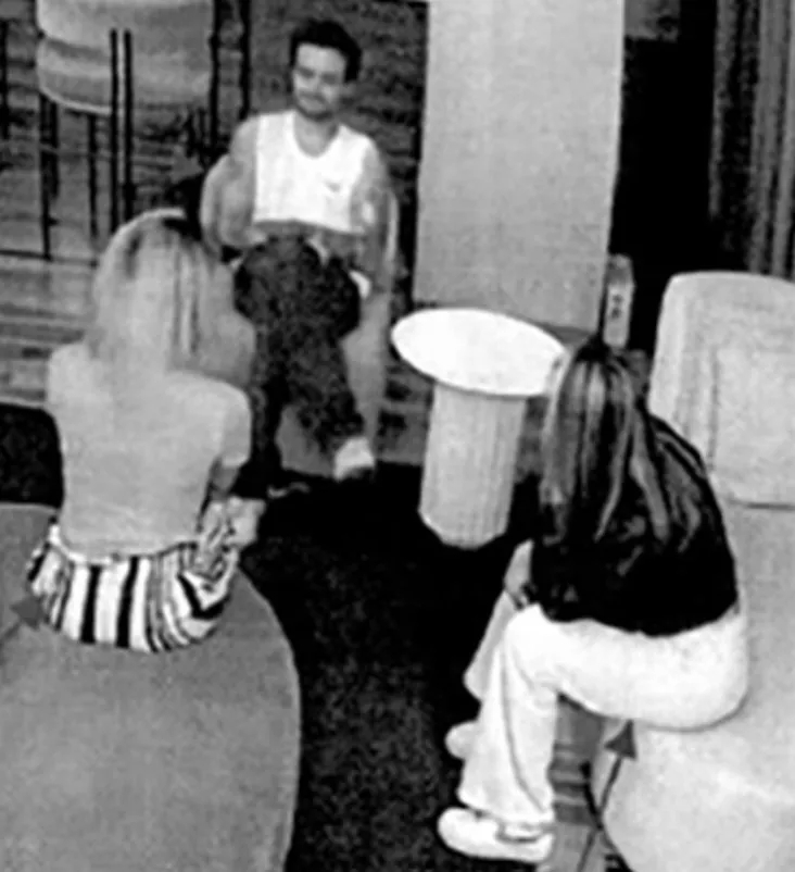CCTV footage of Liam Payne with two women in a hotel room.