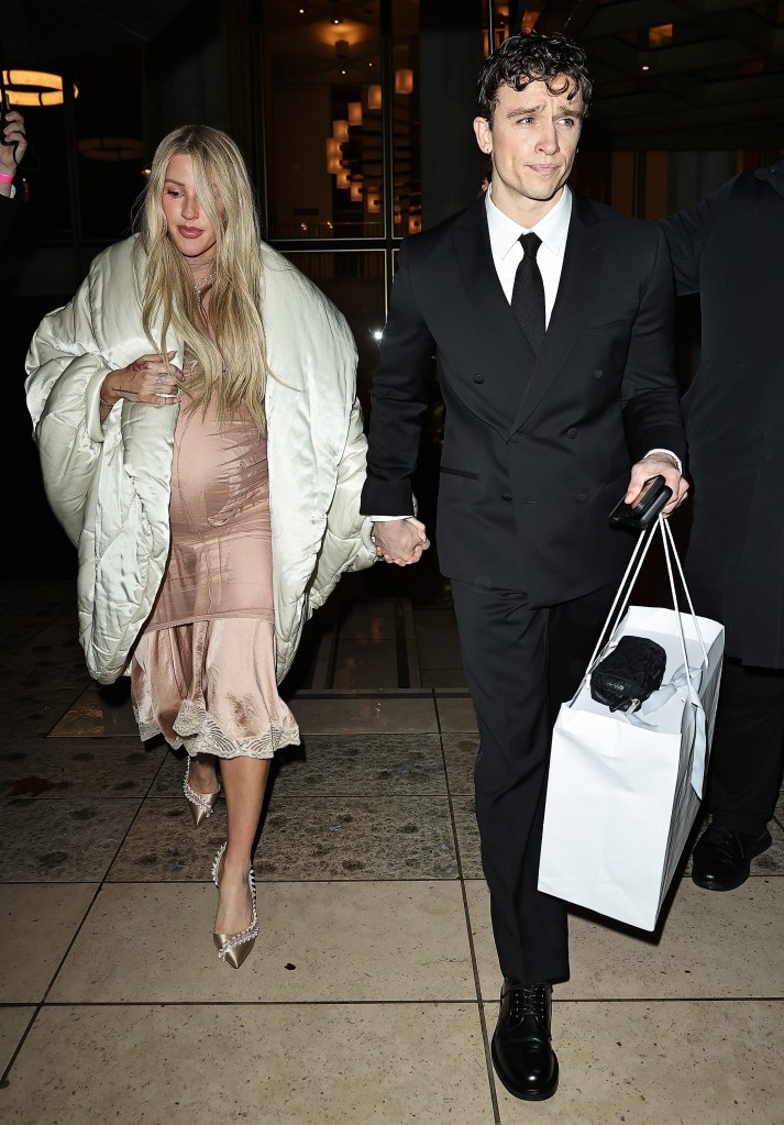 Ellie Goulding and Beau Minnniear holding hands at the BAFTA Invest In Talent Gala.