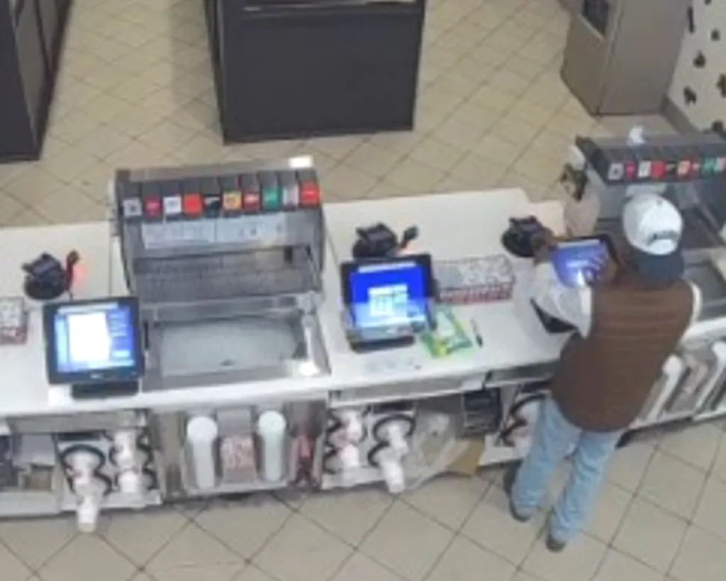 Security camera footage showing Jones ringing up false Chick-Fil-A orders at the register.