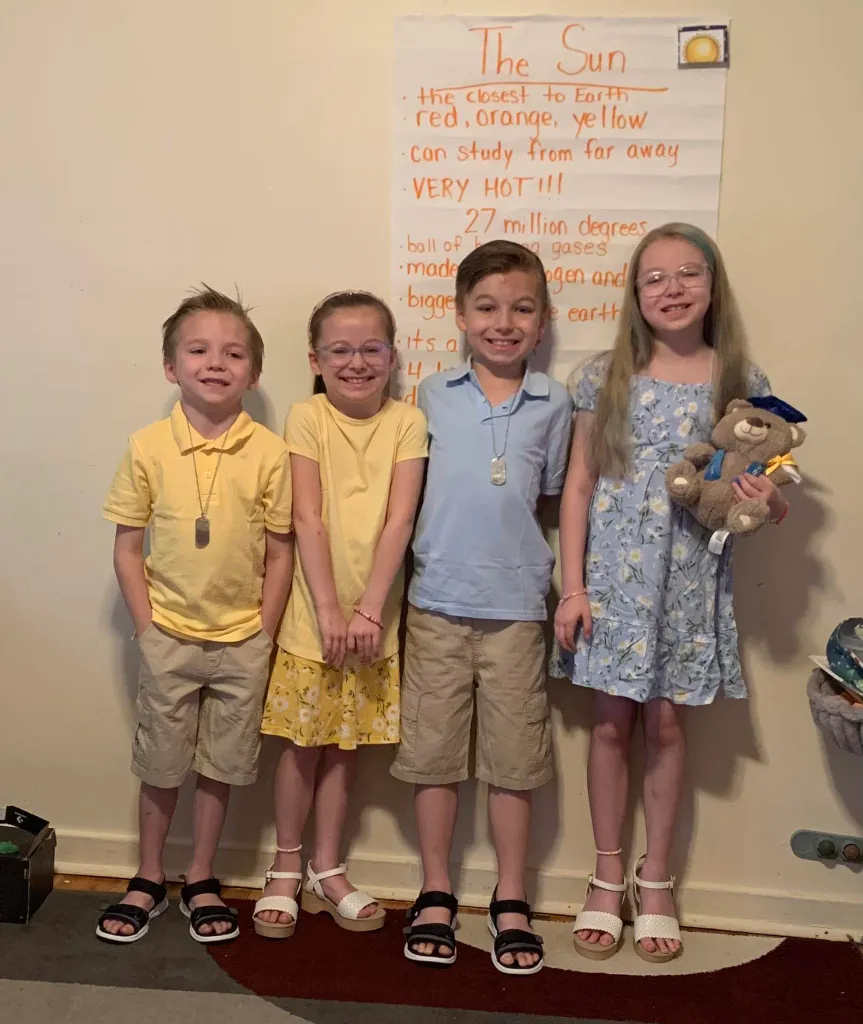 Harper Harmon, Hudson Harmon, Gavin Harmon, and Gracelynn Harmon smiling at the camera.