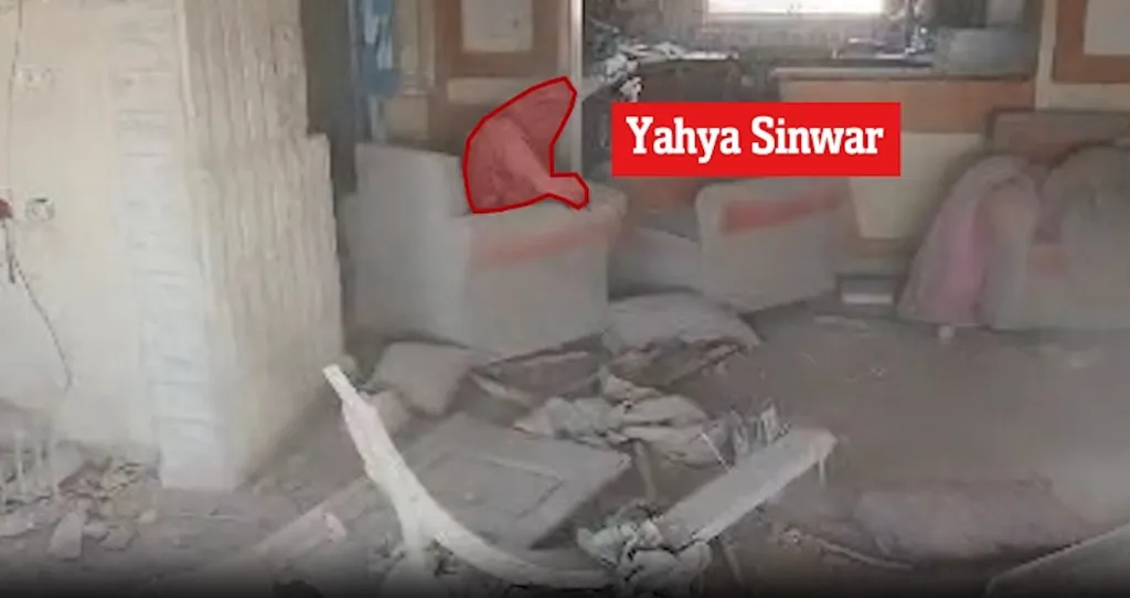 Video frame of Yahya Sinwar throwing a stick at a drone.