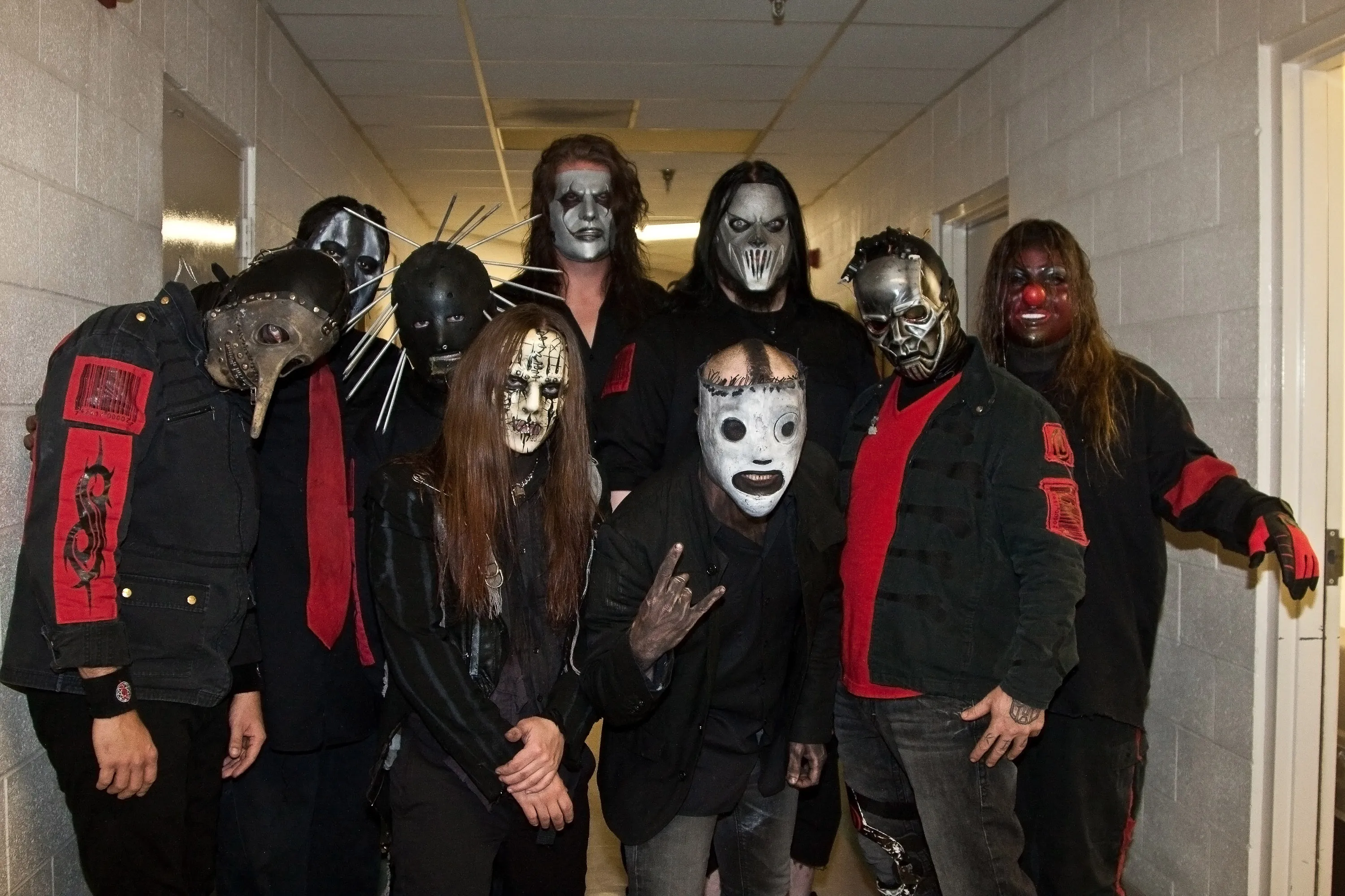 The band Slipknot in costumes backstage.