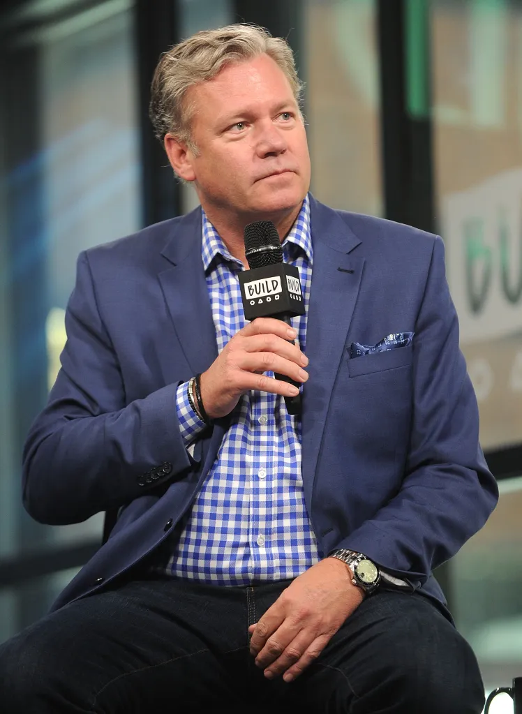 Chris Hansen holding a BUILD microphone.