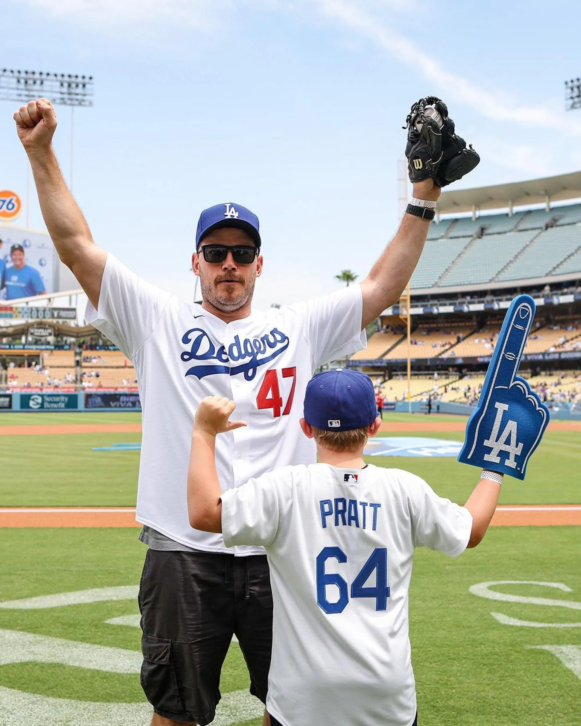 Chris Pratt and his son Jack on a baseball field.