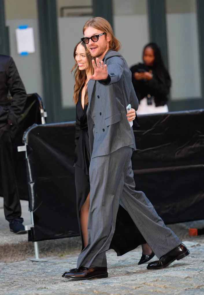Claudia Sulewski and Finneas O'Connell walking in New York City.