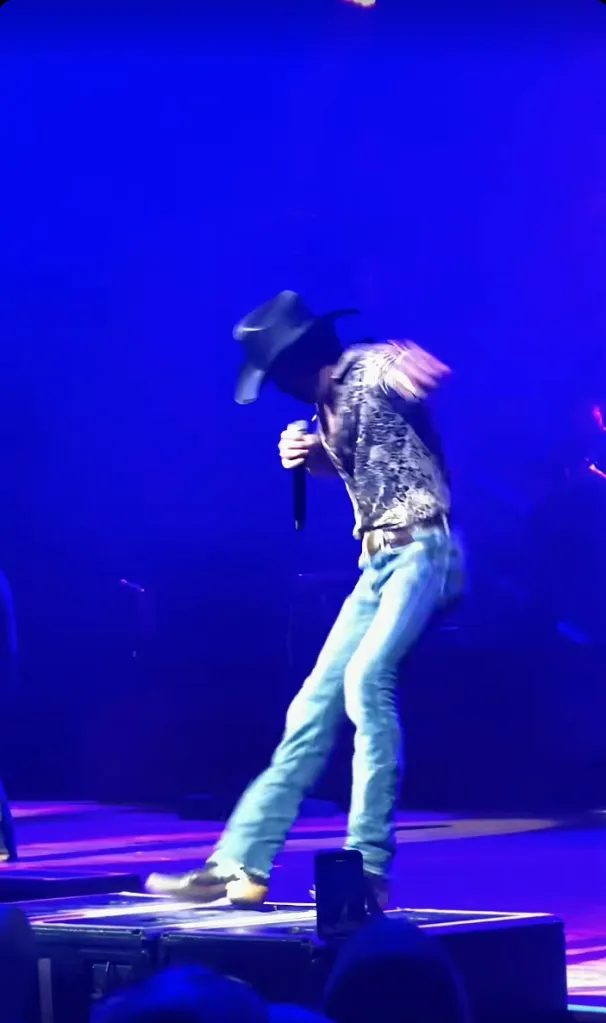 Tim McGraw stumbling on stage while performing.
