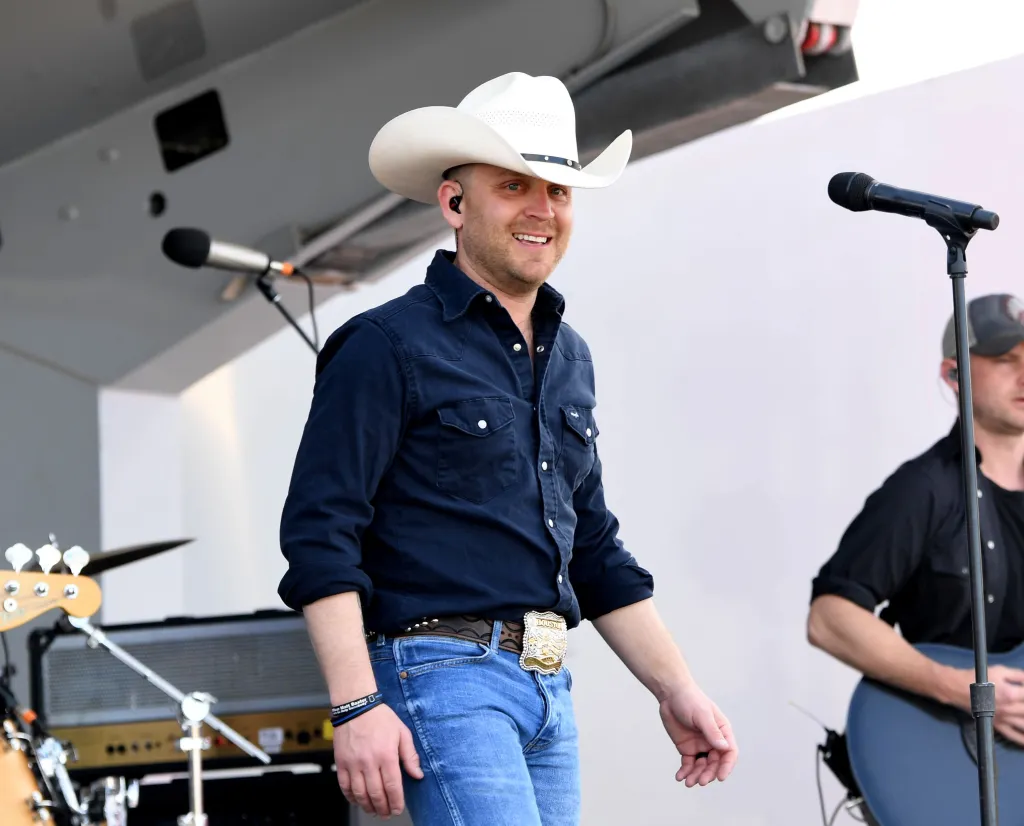 Country music singer Justin Moore performs at the ACM PFAC - USO performance at Nellis Air Force Base.