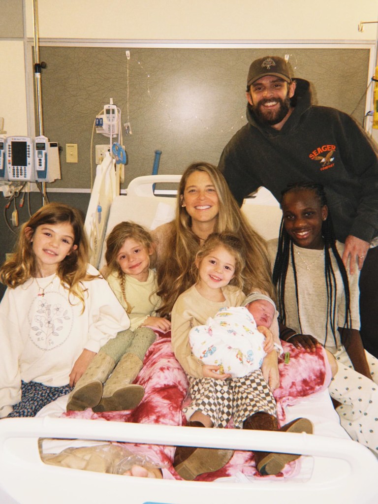 Country singer Thomas Rhett and his wife, Lauren Akins, with their five children, including their newborn.