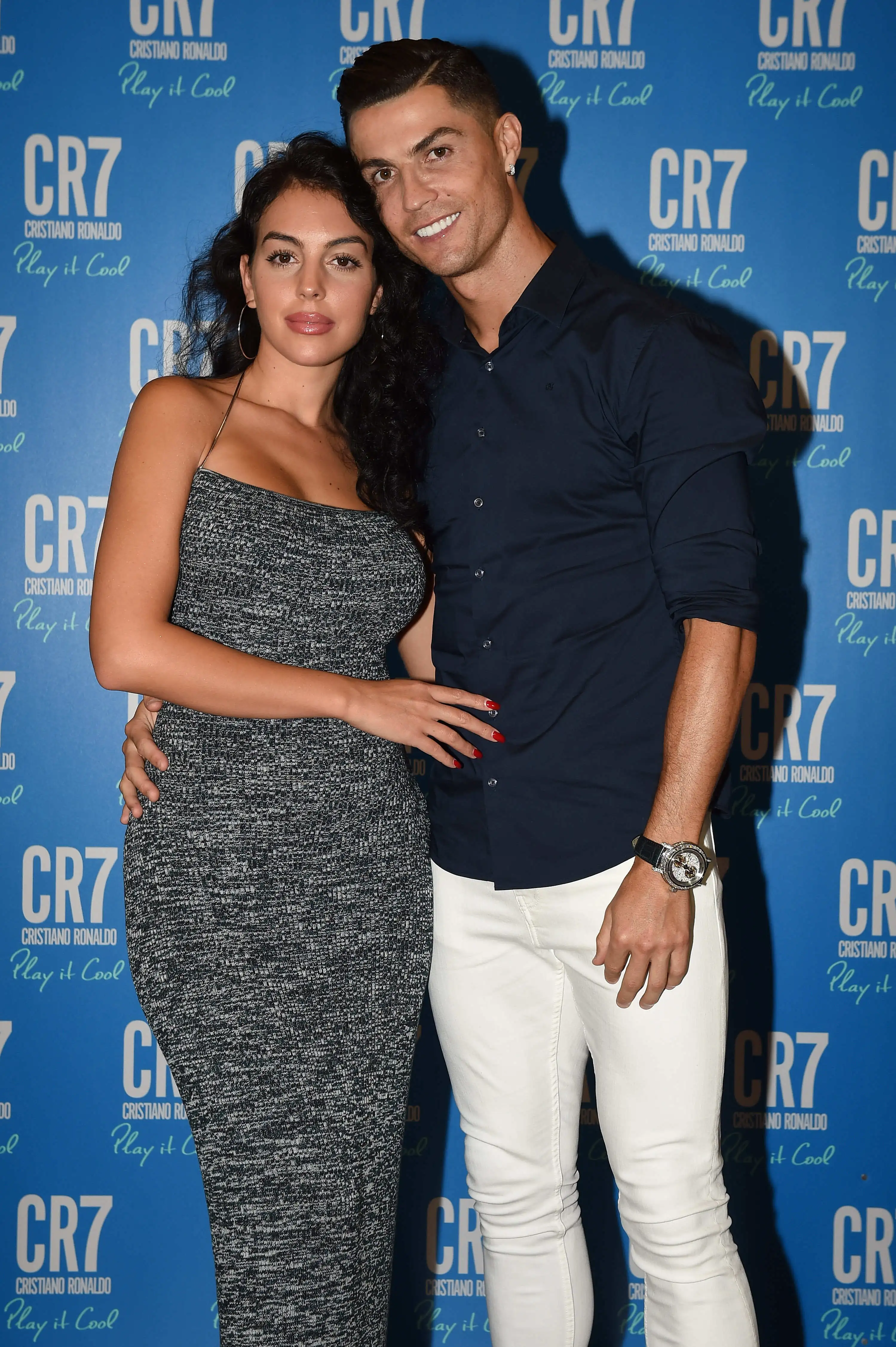 Cristiano Ronaldo and Georgina Rodriguez pose together at the launch of the new CR7 Play It Cool fragrance.