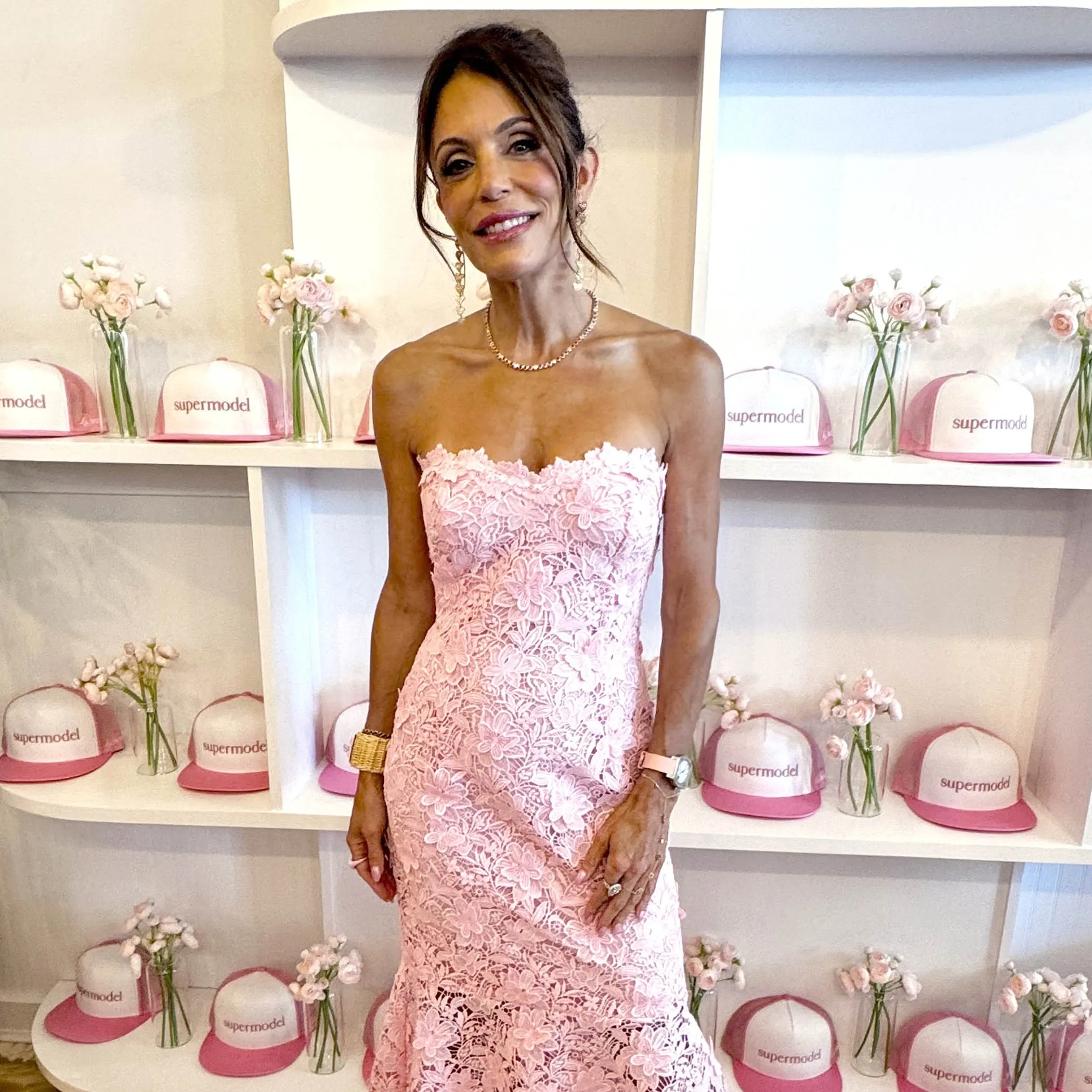 Bethenny Frankel in a pink lace dress at her Supermodel Cafe pop-up.