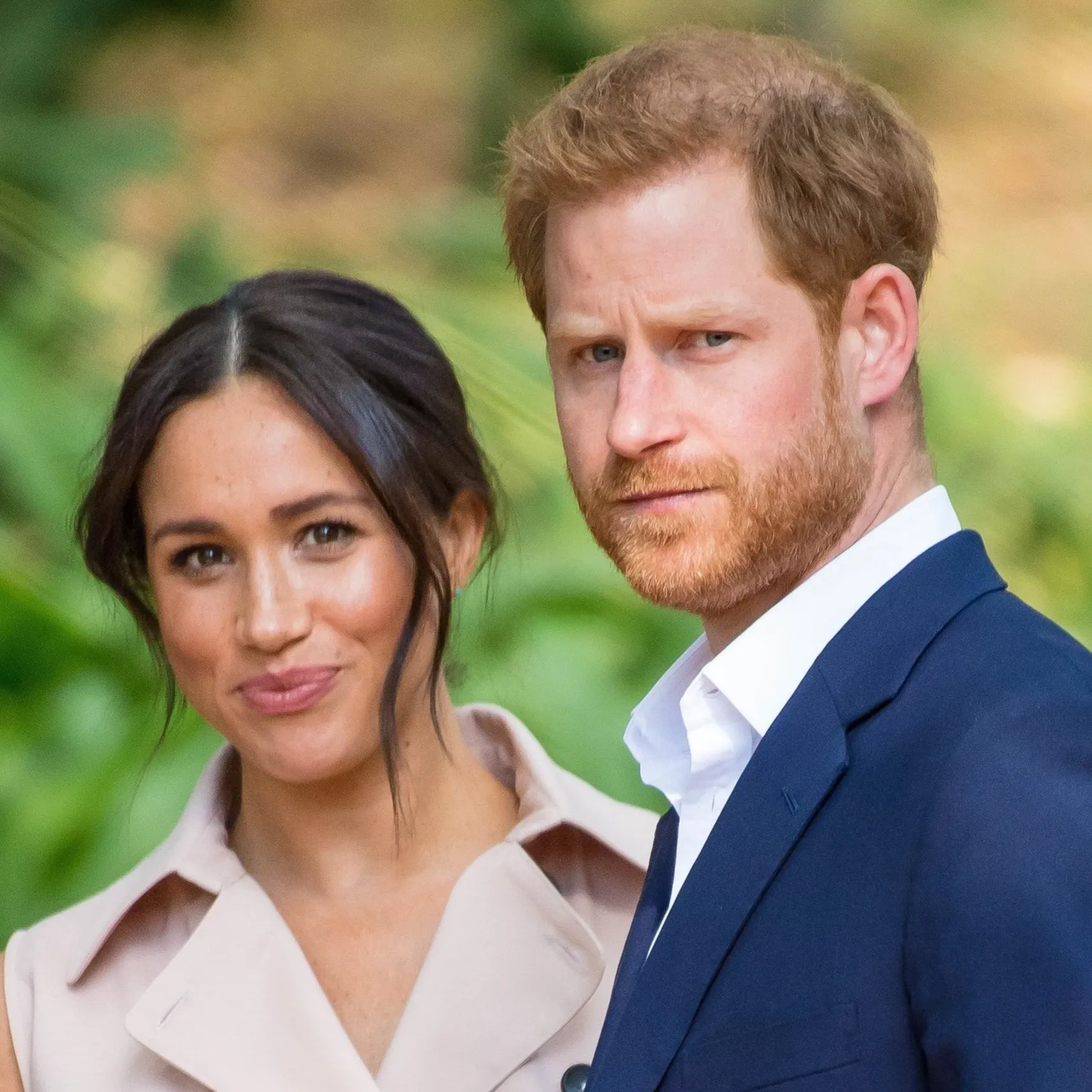 Prince Harry, Duke of Sussex, and Meghan Markle, Duchess of Sussex, standing together outdoors.