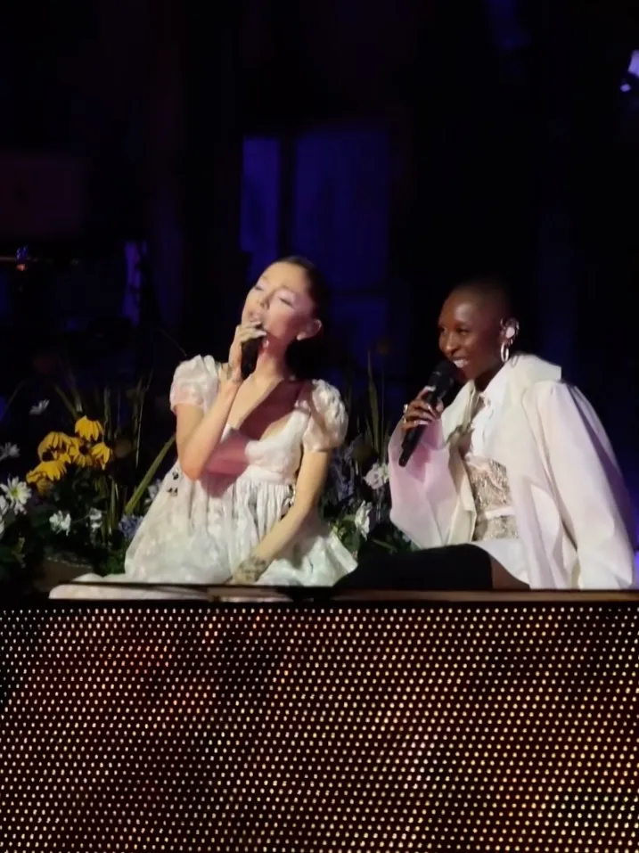 Ariana Grande and Cynthia Erivo performing together on stage.