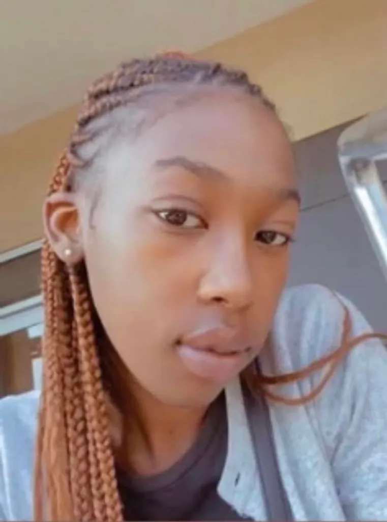 A close-up photo of Dasia Johnson, a woman with braided hair.