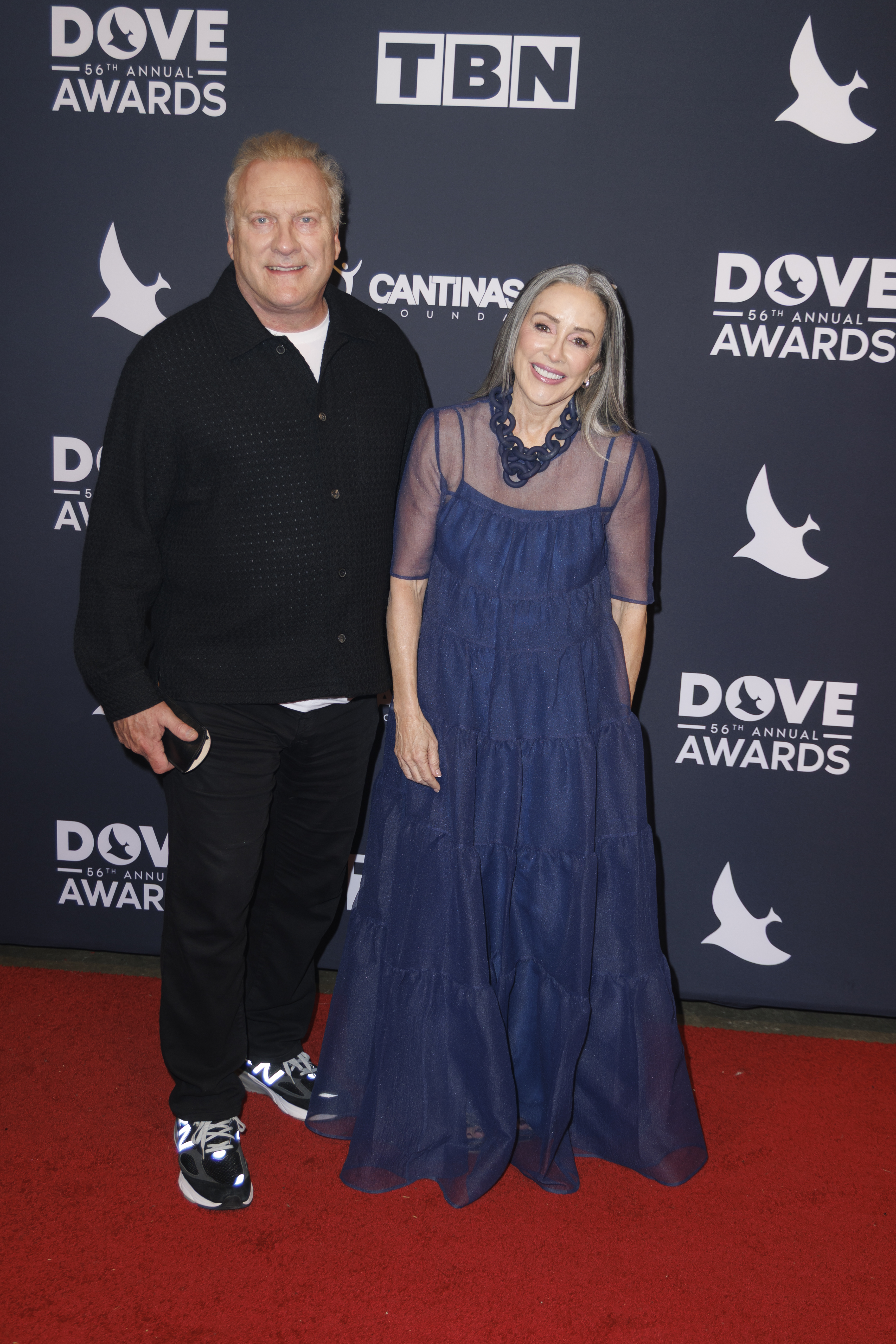 David Hunt and Patricia Heaton walking the red carpet at the 56th Annual GMA Dove Awards.