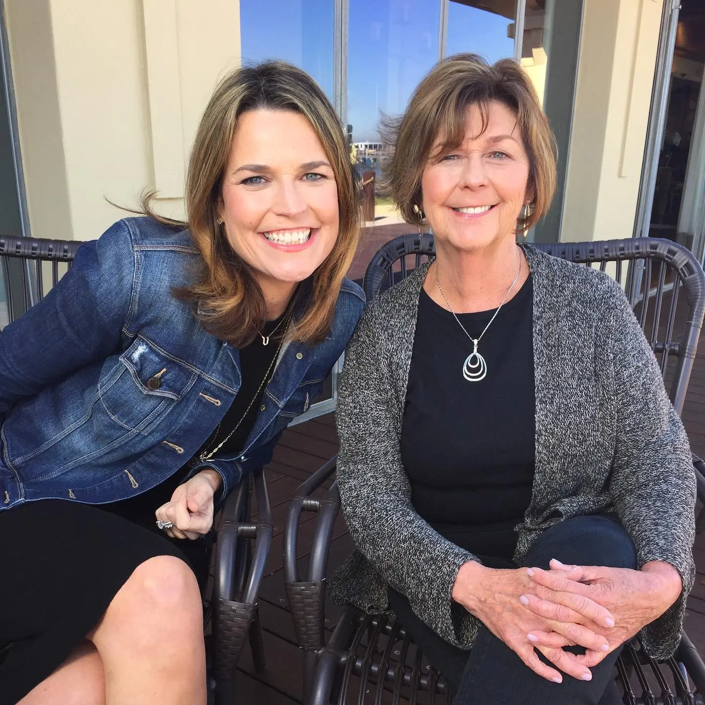 Savannah Guthrie and her mother, Nancy Guthrie, smiling while sitting in chairs.