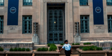 Prosecutor Sues Justice Dept. Over Dismissal After Right-Wing Influencer’s Claim
