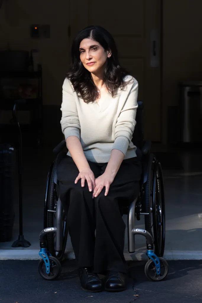 Debbie St. John, injured on 9/11, sitting in a wheelchair.
