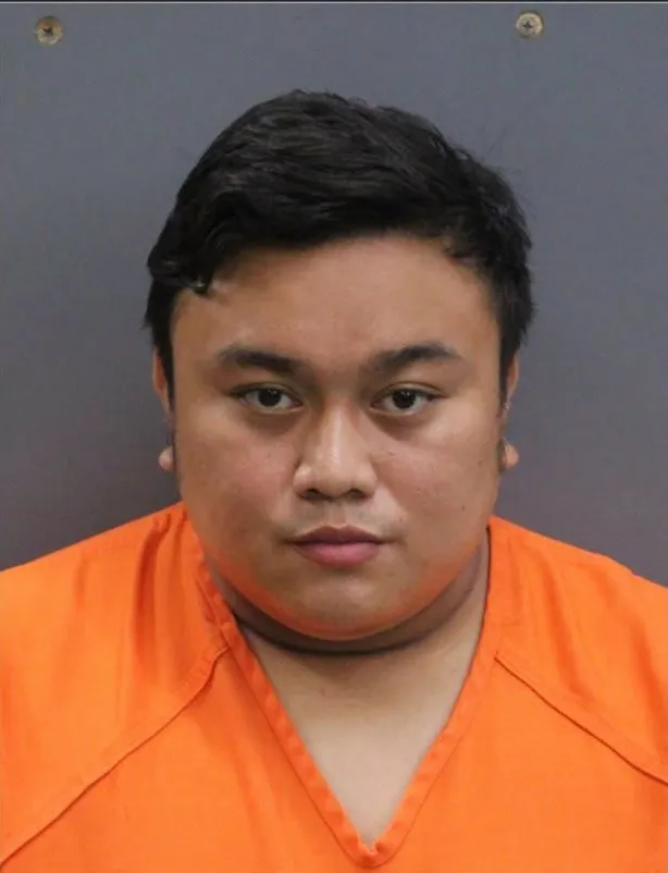 Mugshot of Christian Schneider in an orange shirt.