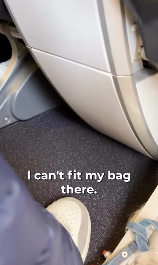 A view of the plane's floor and the feet of a person in a wheelchair, with a caption saying 