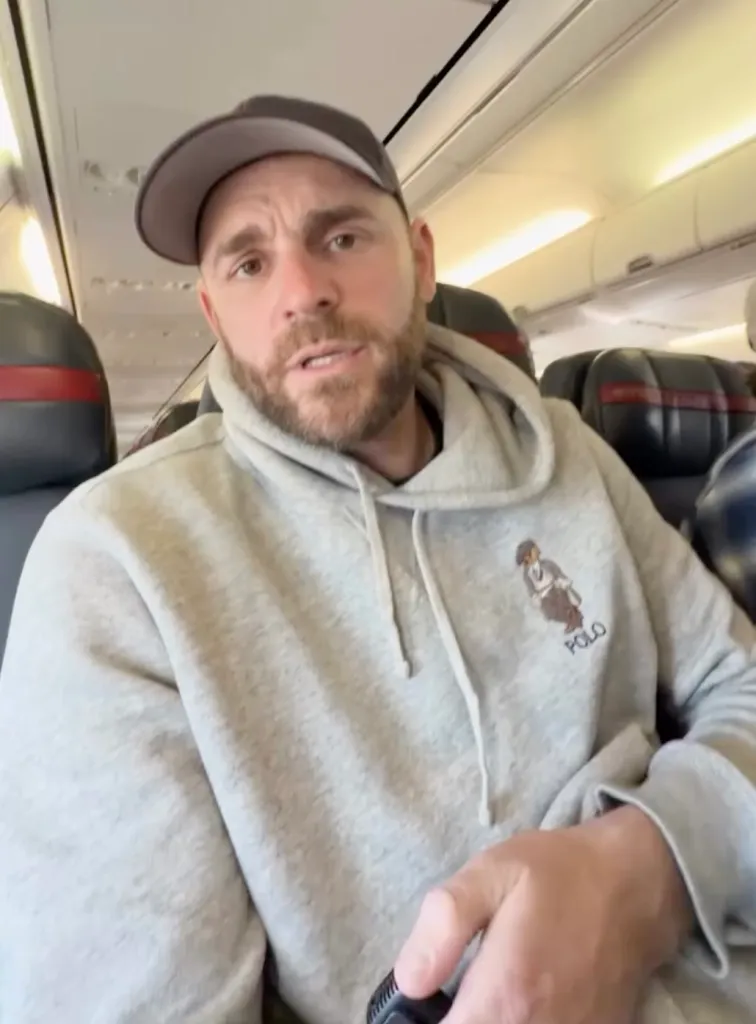 Shane Hryhorec sitting on an airplane.