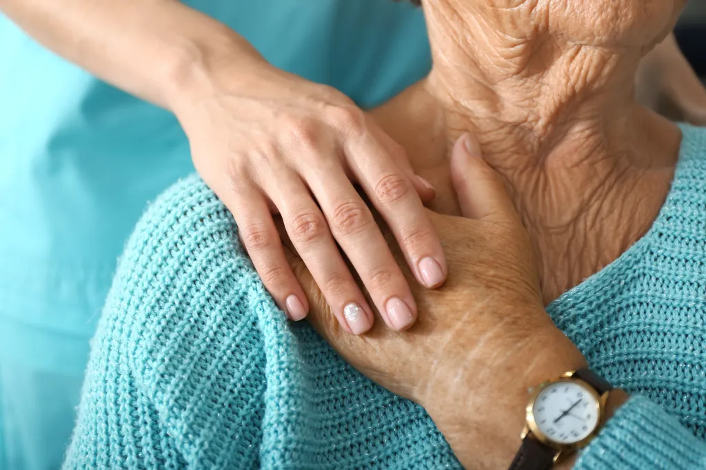 A doctor supports an elderly woman in a clinic on Friday, June 21, 2019. (280820527)