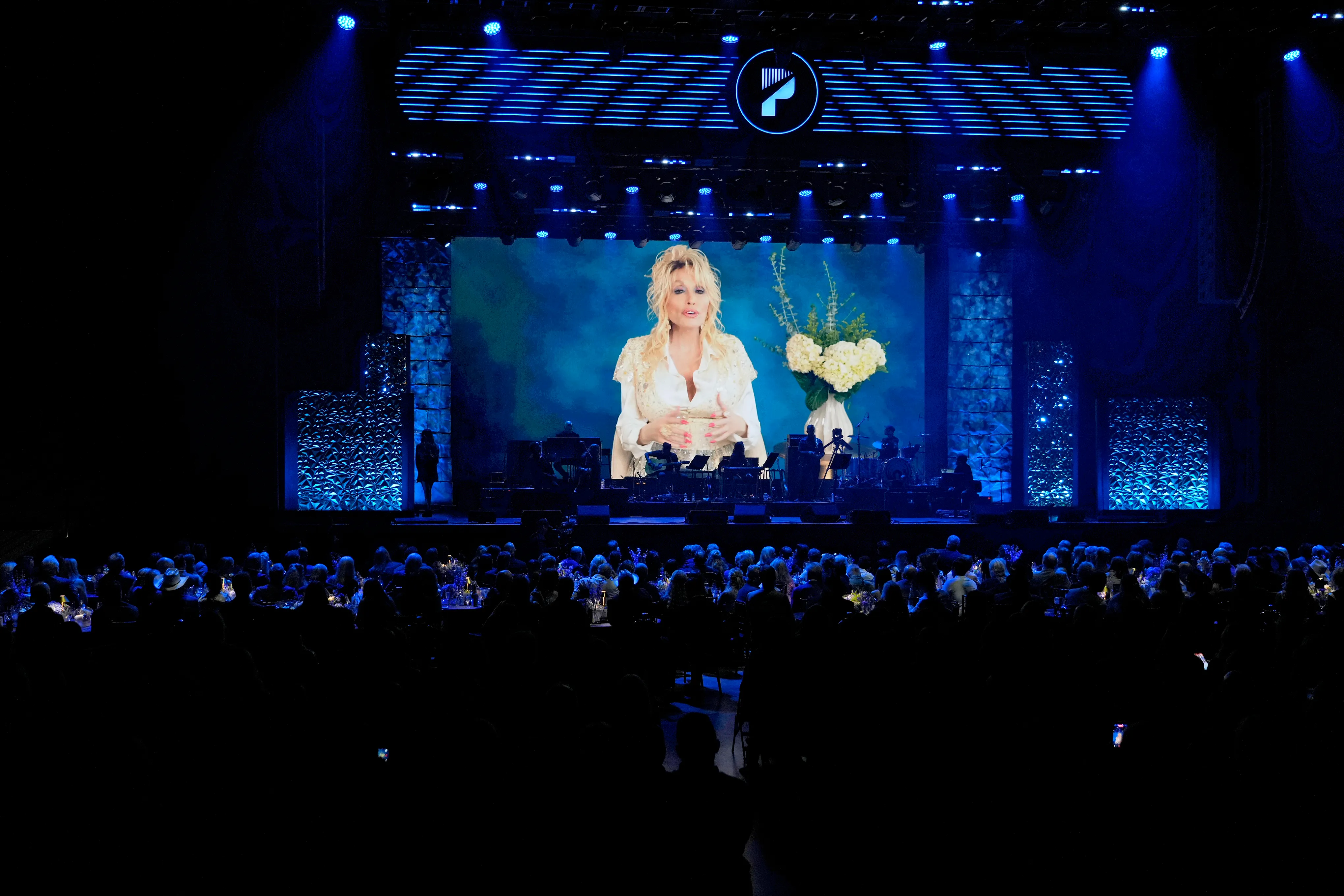 Dolly Parton accepts the ACM Poet's Award onstage during the 19th ACM Honors.