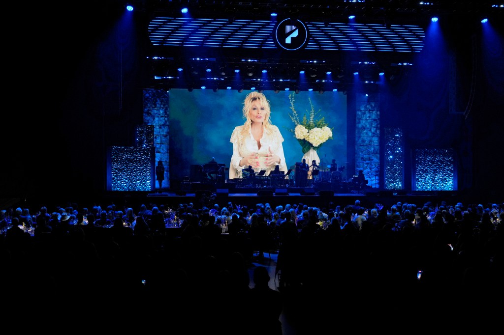 Dolly Parton accepts the ACM Poet's Award onstage during the 19th ACM Honors.
