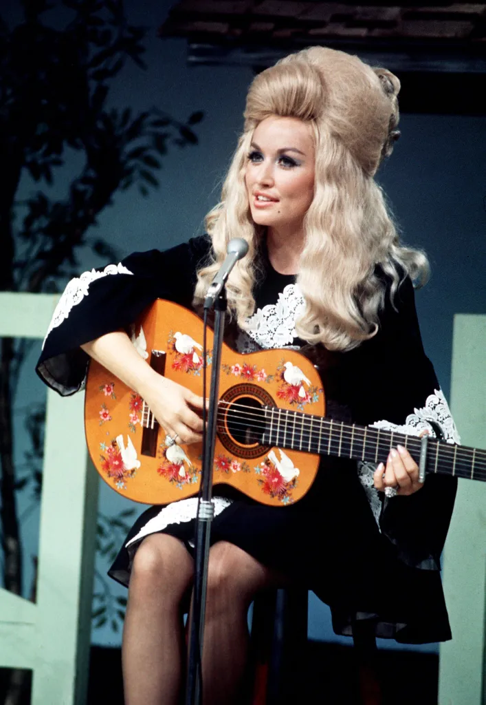 Dolly Parton performing a song during the taping of 