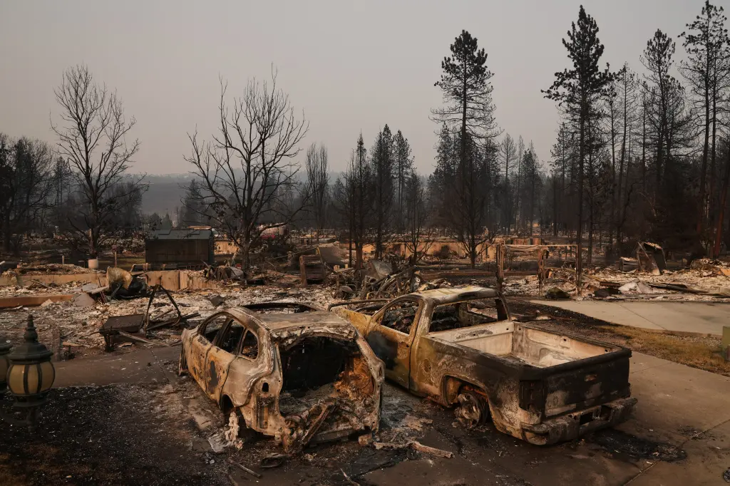 Dozens of homes are seen burned to the ground after a wildfire hit the northern part of Spokane, Wash., Monday, Aug. 3, 2026.