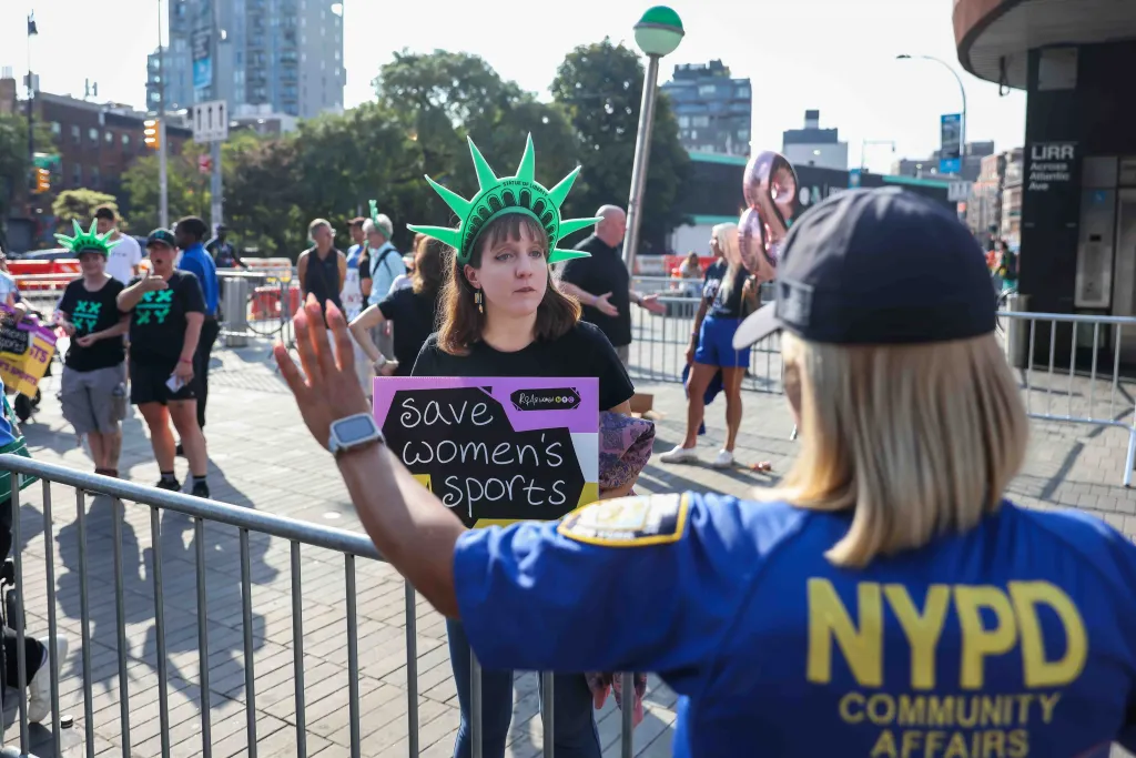 Dr. Elizabeth Fedak, wearing a Statue of Liberty crown, holds a 