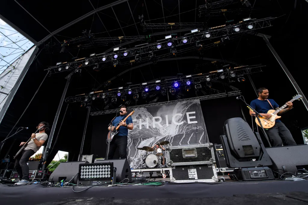 Thrice band members perform on stage at the Download Festival.