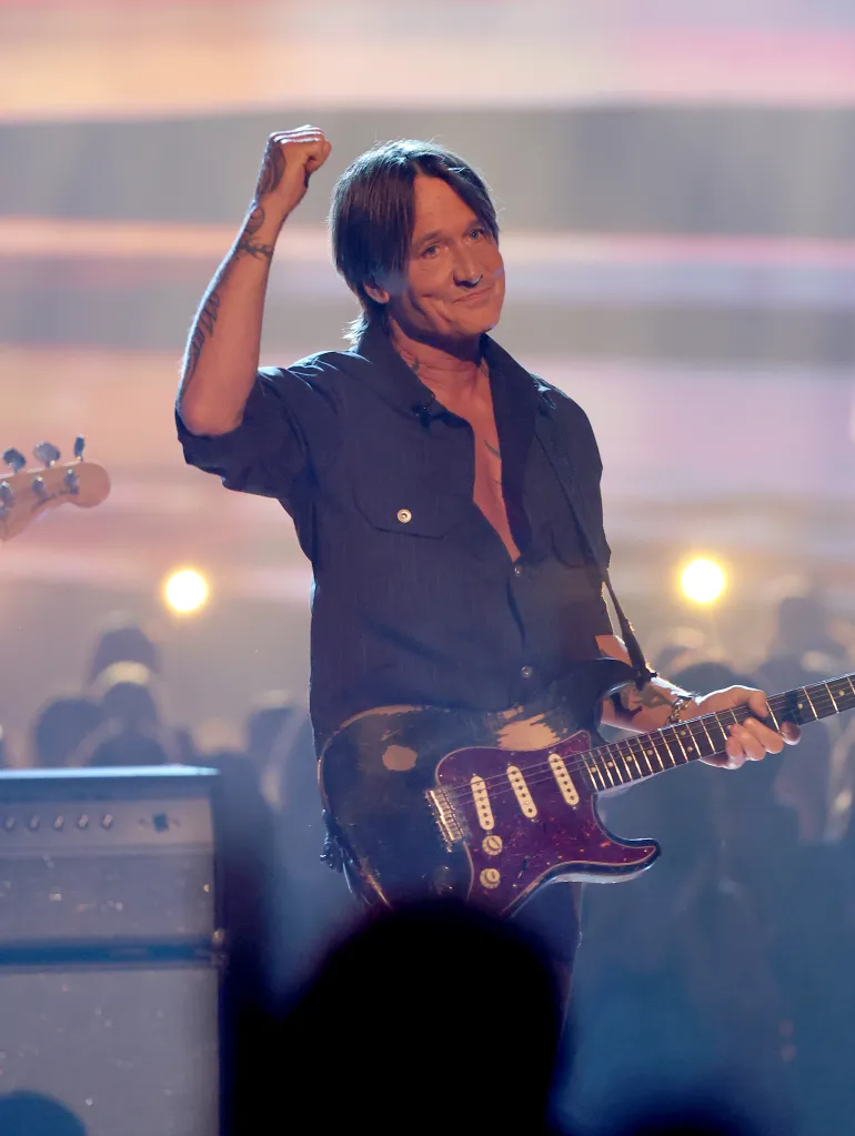 Keith Urban performing onstage at the 52nd American Music Awards.