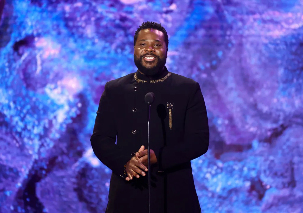 Malcolm-Jamal Warner speaking at the 65th GRAMMY Awards Premiere Ceremony.