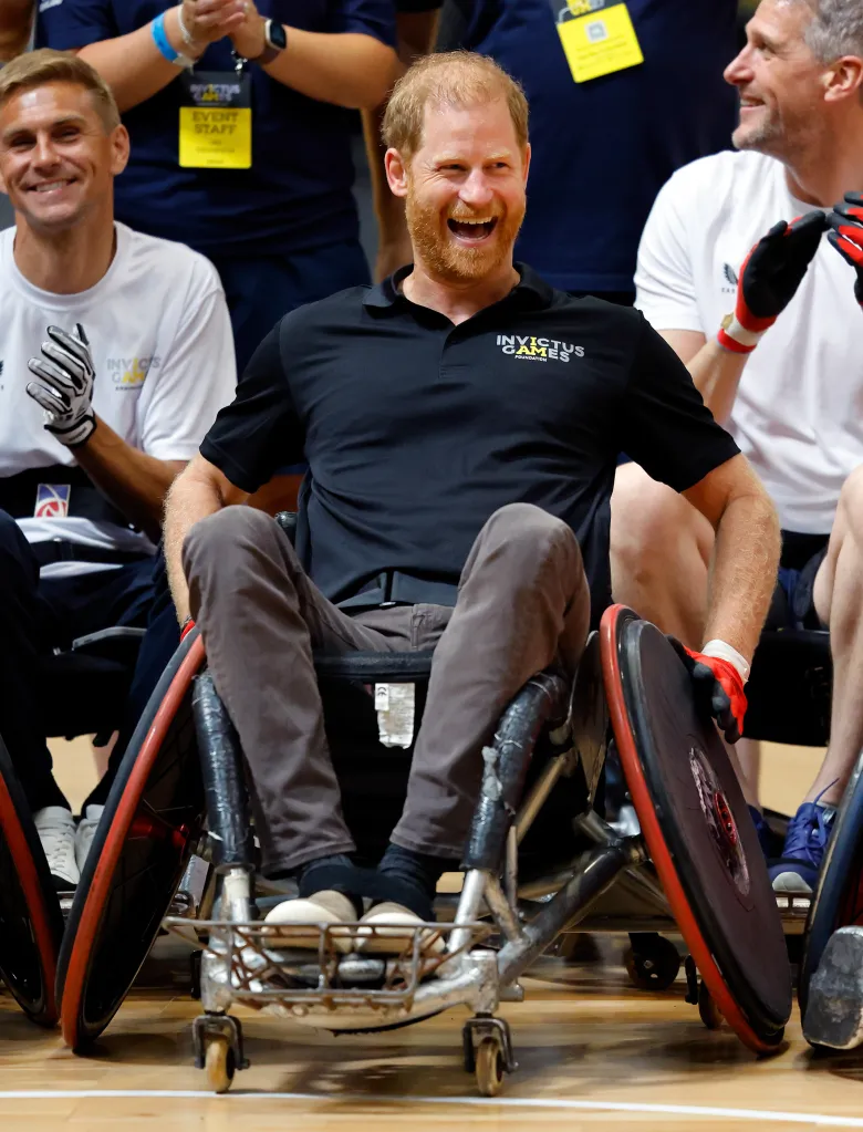 Prince Harry, Duke of Sussex, in a blue Invictus T-shirt and grey jeans plays wheelchair rugby at the Invictus Games 1 Year To Go event.