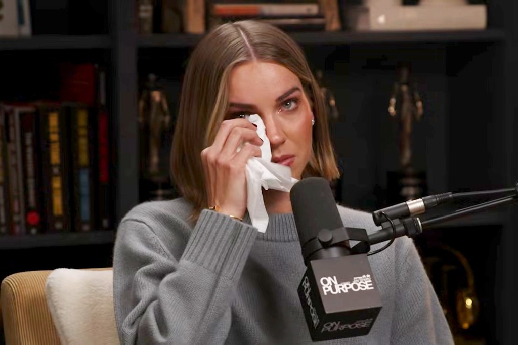 Emilie Kiser wipes away tears while discussing her son Trigg's drowning in an interview with Jay Shetty.